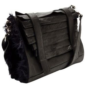Collina Strada black leather muff purse bag